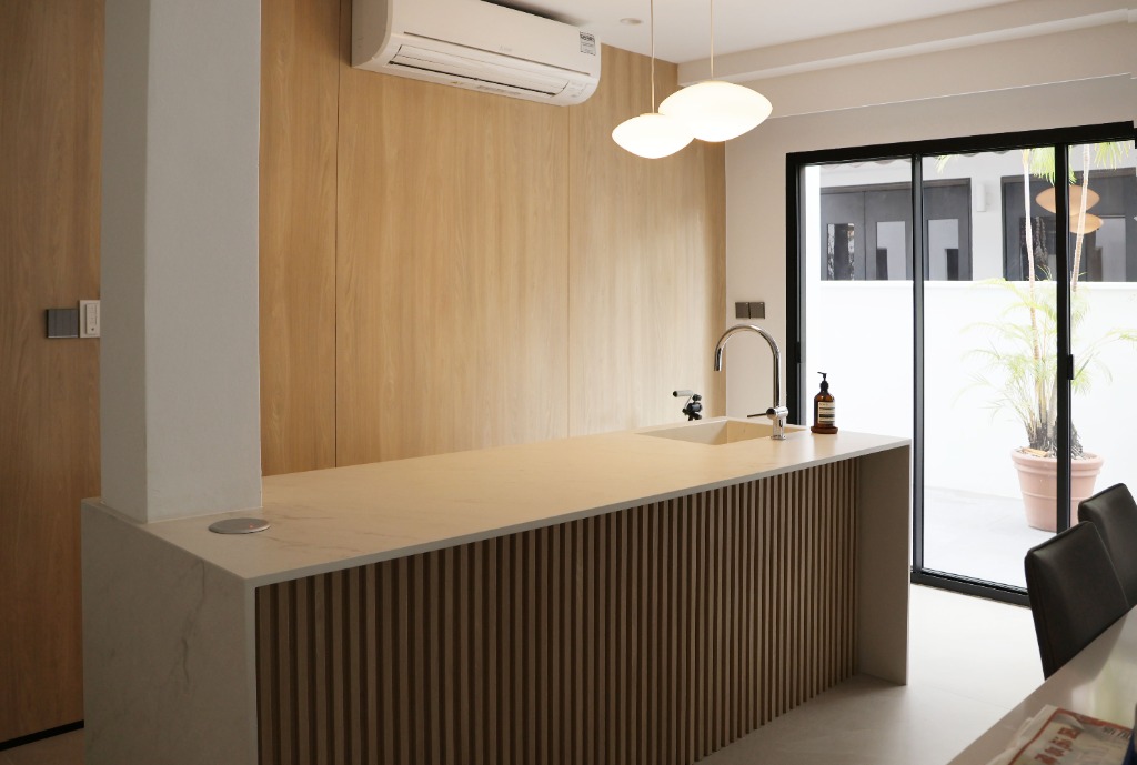 Modern living room with entertainment center and fitness weights